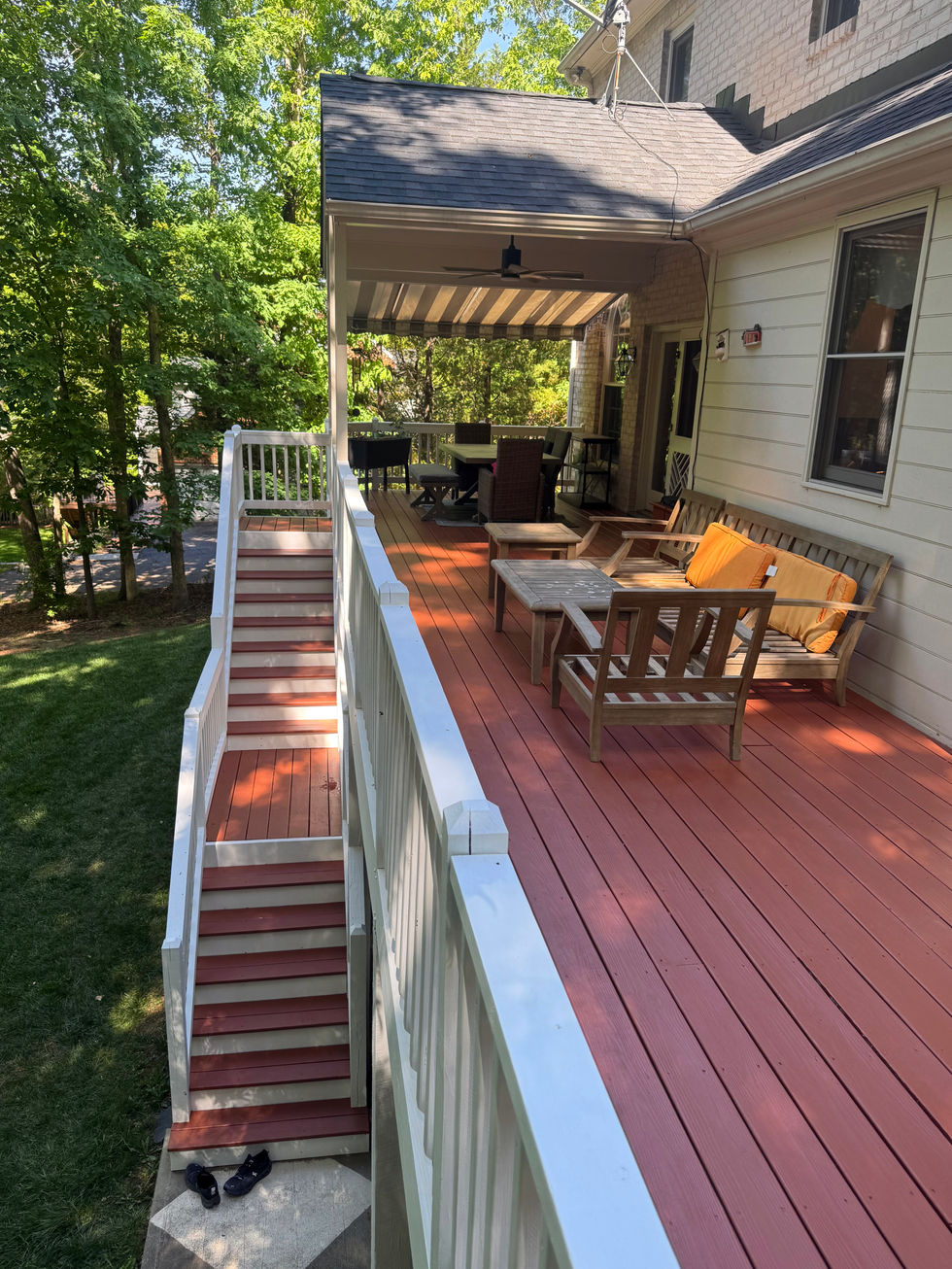 deck after being repainted a dark reddish brown