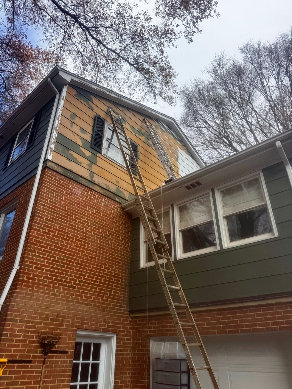 home exterior in the process of being repainted