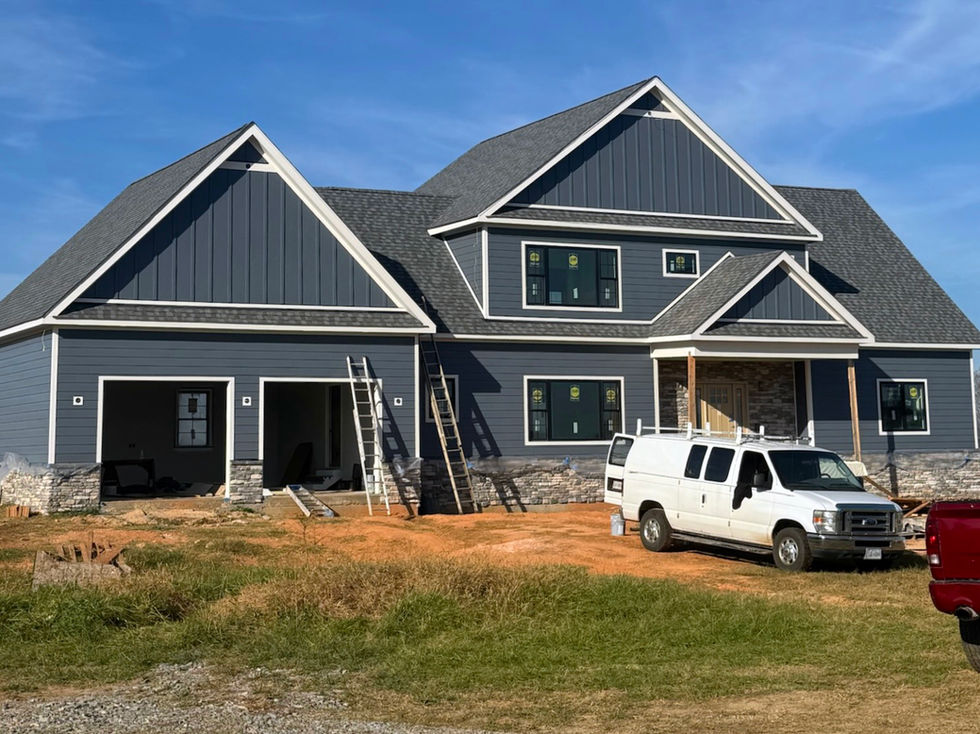 front exterior of a newly constructed home after being painted blue