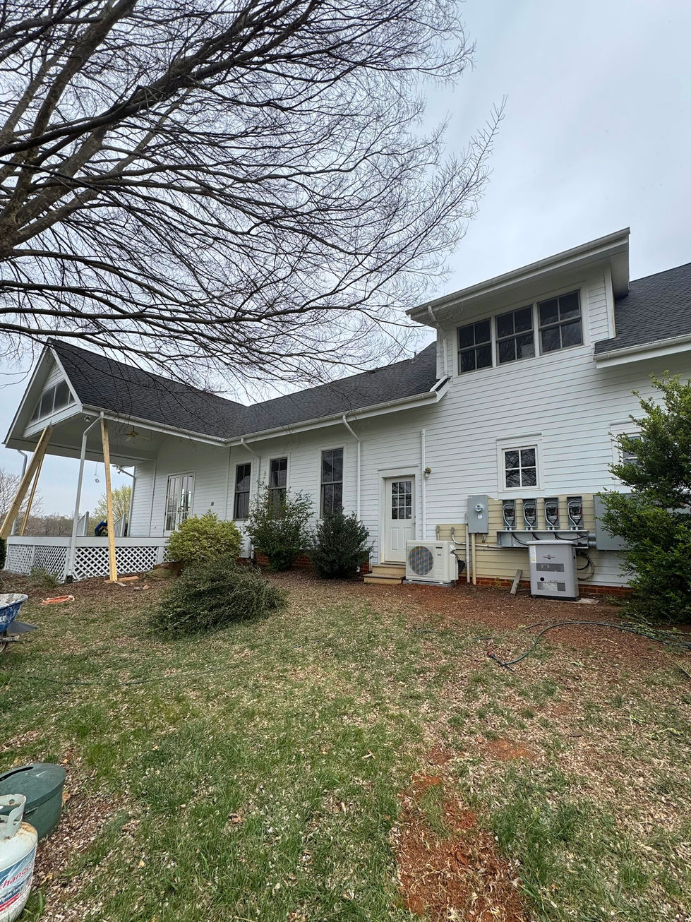 back exterior of a home after being painted white