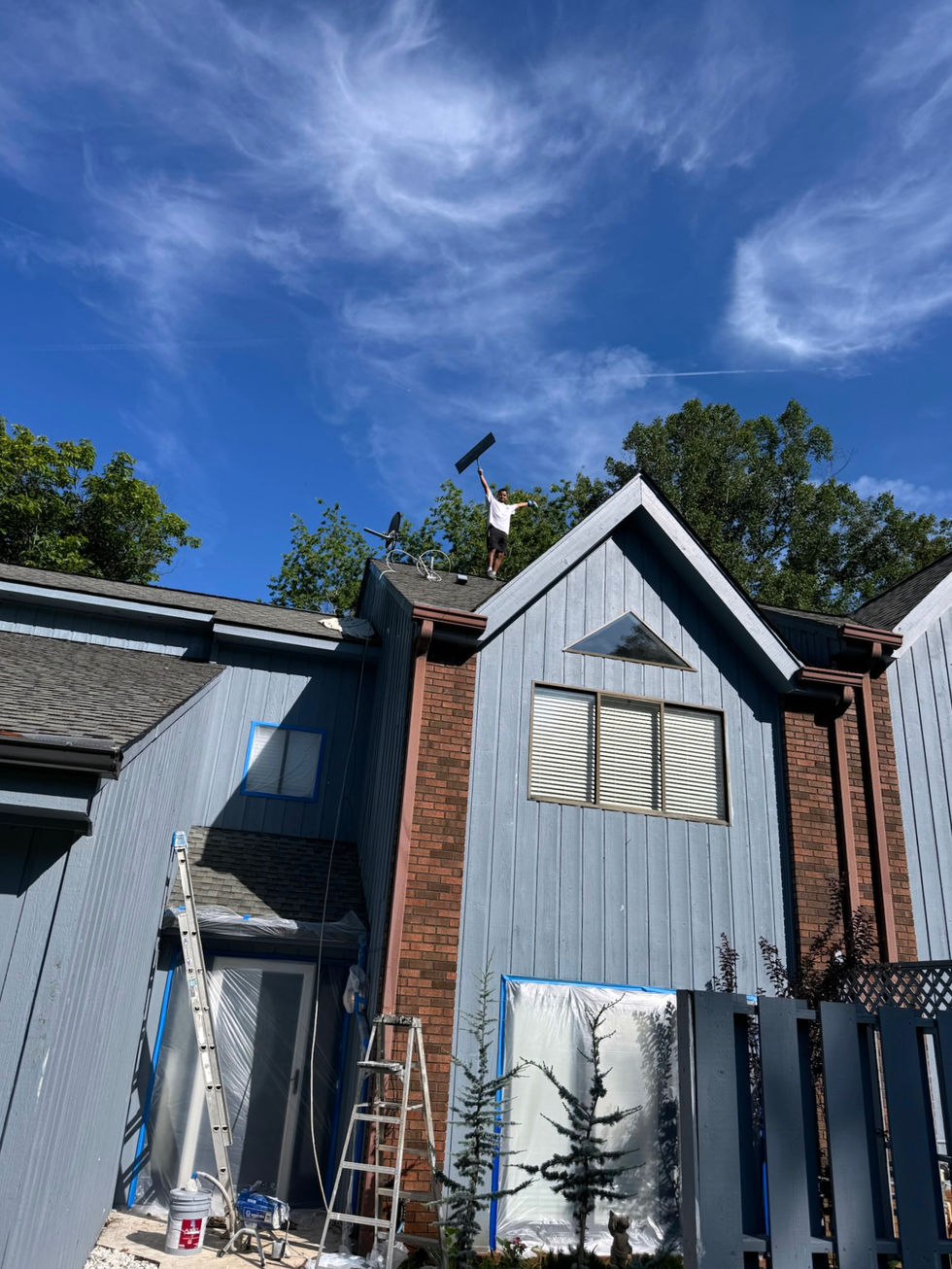 blue and brown town homes being repainted