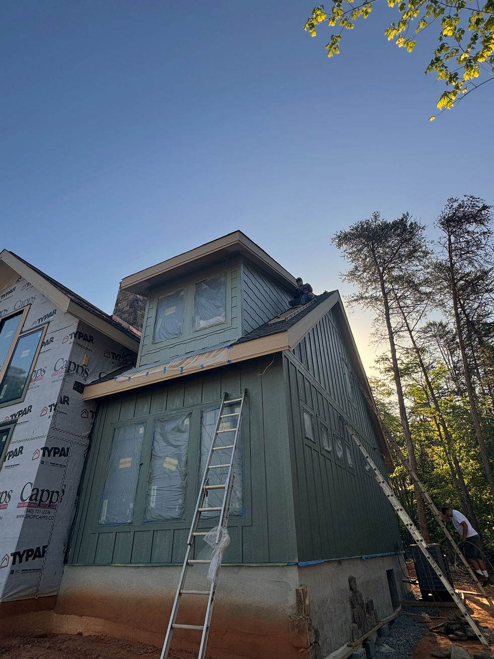 exterior of a newly constructed home after being painted teal