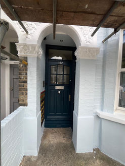 Navy blue front door and painted porch brickwork by PK Decorating Wimbledon