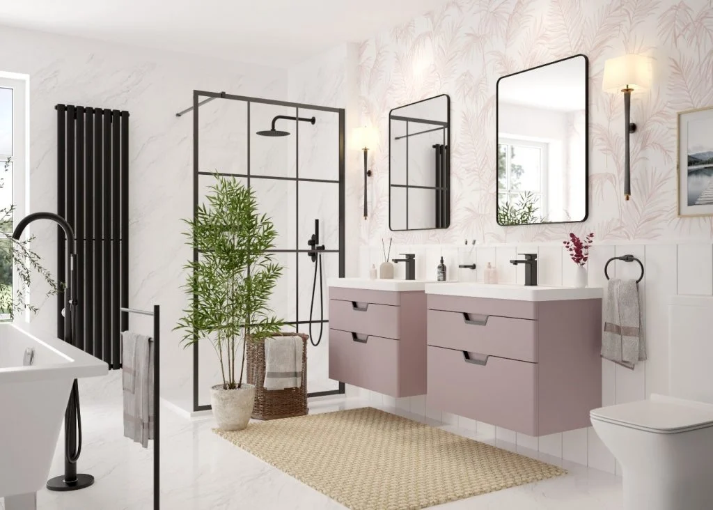 Bathroom with two pink wall hung vanity units with matt black handles and hardware 