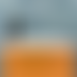 Orange cloakroom vanity unit with matt black cloakroom tap. Horizontal stacked aqua blue subway tiles