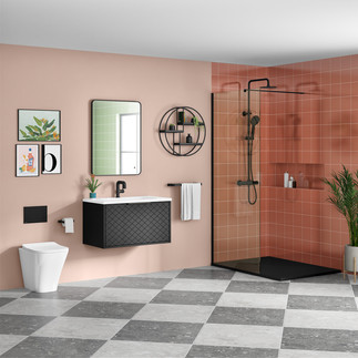 Modern bathroom with a black vanity, wall-mounted sink, pink tiled shower, and decorative plants against a pink wall.