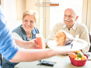 Happy seniors enjoying nutritious meals at Brantford Retirement Manor senior living residence