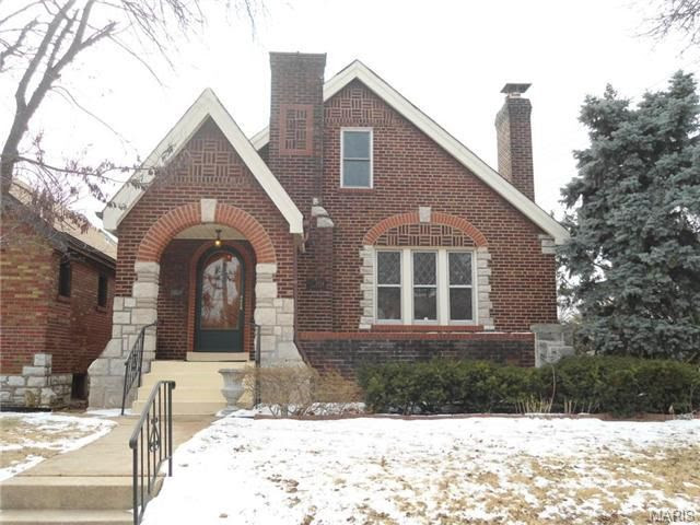 Exterior front view of a 1937 brick bungalow before renovation.