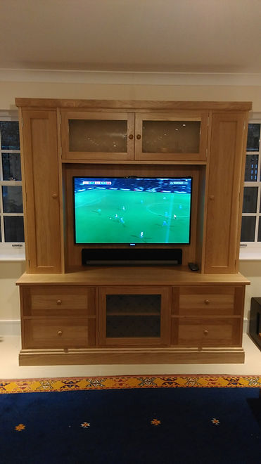 oak freestanding media wall with shelves and drawers