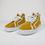 Thumbnail: A pair of ochre and white coloured high top trainers made by CaulainCourt, Paris. Here the right and left shoes are stacked side by side. 