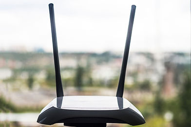 close-up-of-wireless-router-by-window-1025071730-5c4bac4346e0fb0001a8e6e6.jpg