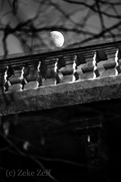 Evening moon over bridge