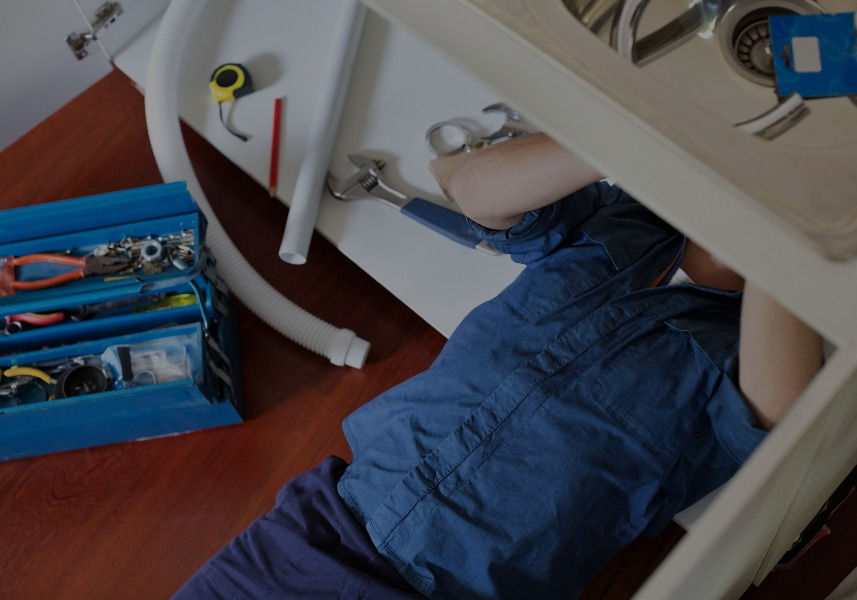 Plumber%20Fixing%20Sink_edited_edited.jpg