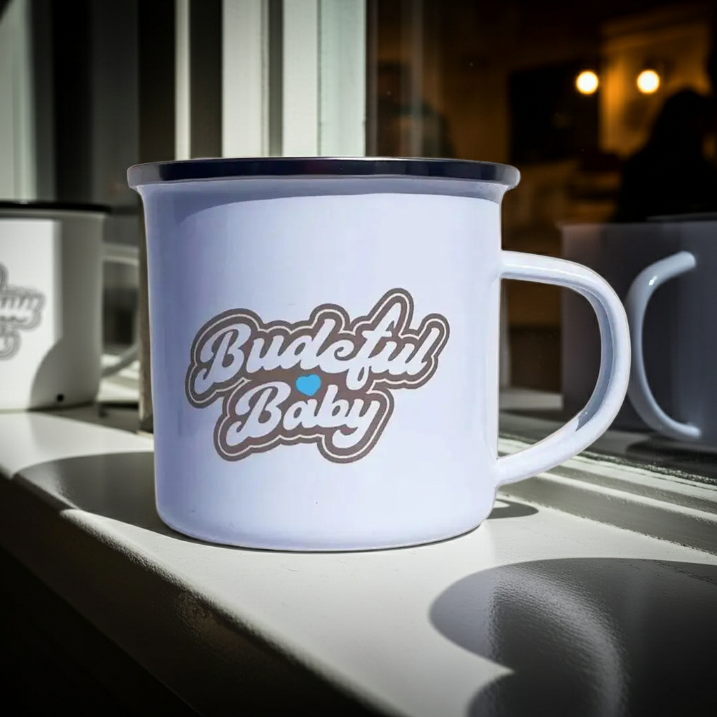 Budeful Baby Boy enamel mug with Budeful Baby font and heart with baby feet logo, styled as a newborn gift.