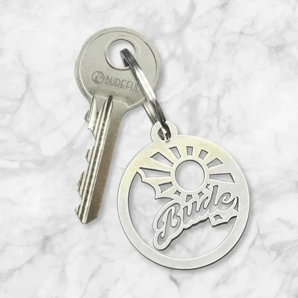 Bude Sunbeam stainless steel keyring inspired by coastal sunbeams and Budeful logo, handmade in Cornwall