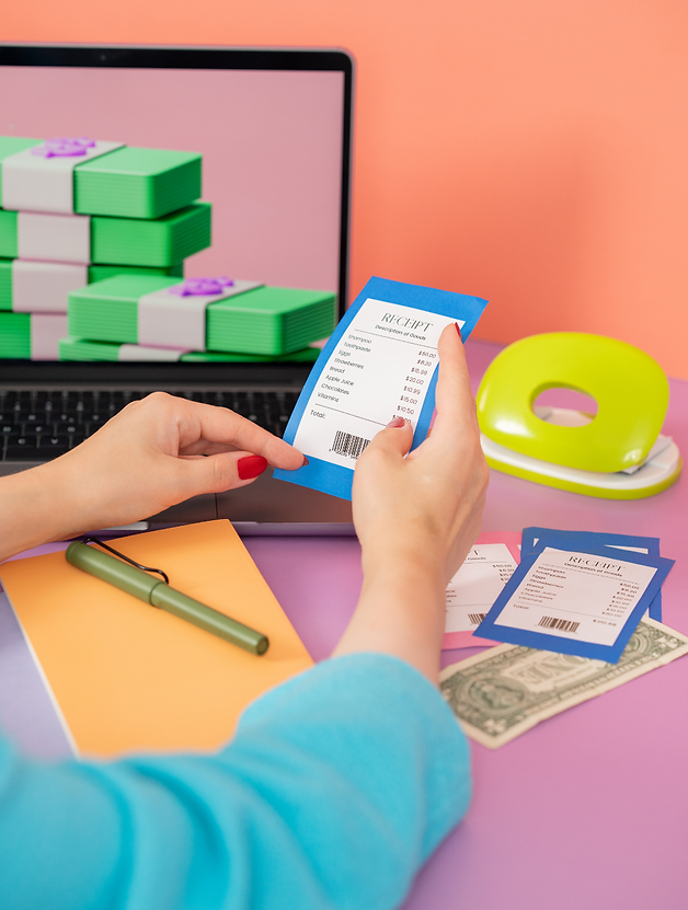 Asian woman looking at a receipt on messy desk