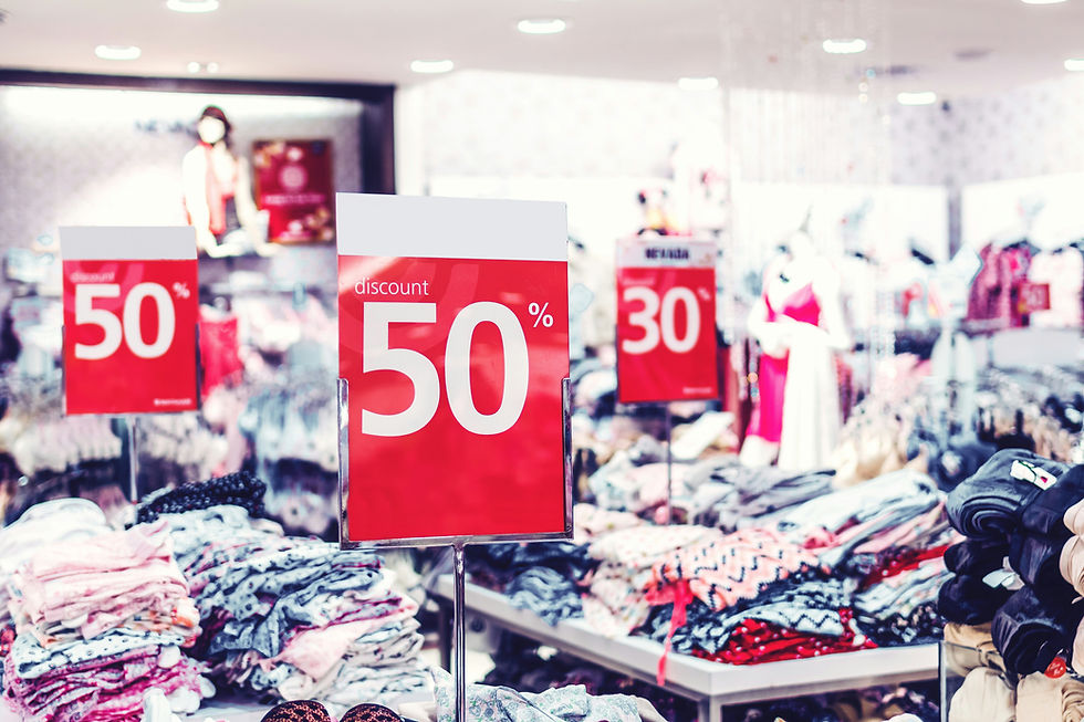 inside a commercial store with rafts full of discounted clothes and accessories