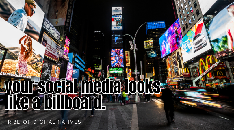 Times Square billboards at night with bold text reading “your social media looks like a billboard,” representing how businesses often treat social media like static advertising instead of strategic marketing.