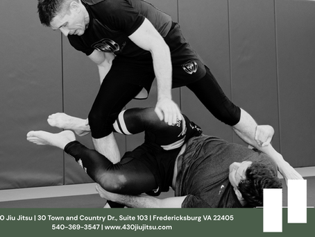 Two students training Brazilian Jiu Jitsu during a live ecological learning session at 4:30 Jiu Jitsu in Fredericksburg, VA, focusing on timing, adaptability, and real-time problem solving.