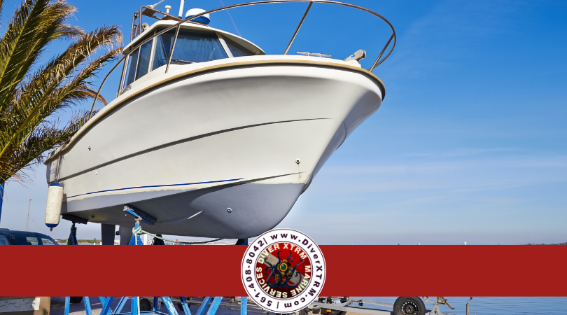Boat hull lifted out of the water at a South Florida marina, illustrating the importance of routine hull cleaning, underwater inspections, and preventative marine maintenance by DiverXTRM Marine Services.