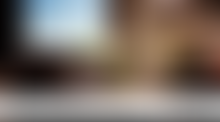 Cozy seating area inside The Andrus Hotel in downtown Dillon Montana with warm lighting and fresh flowers, reflecting a relaxed and walkable boutique stay