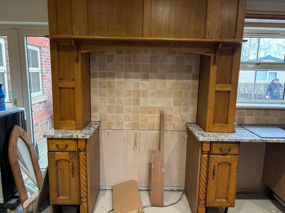 a kitchen with wooden cabinets and granite counter tops