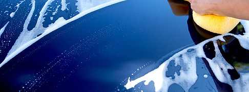 Blue car being washed