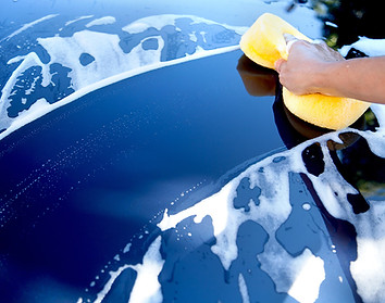 Blue car being washed