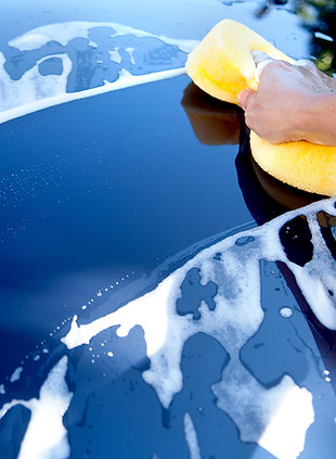 Blue car being washed