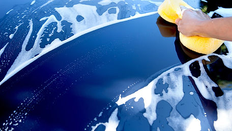 Blue car being washed