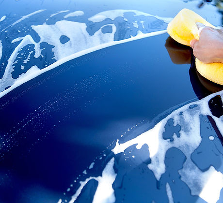 Blue car being washed