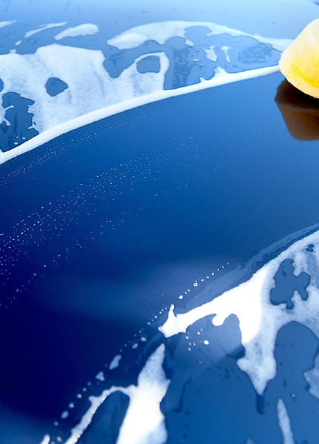 Blue car being washed