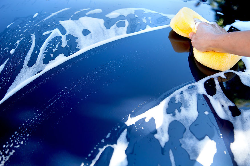 Blue car being washed