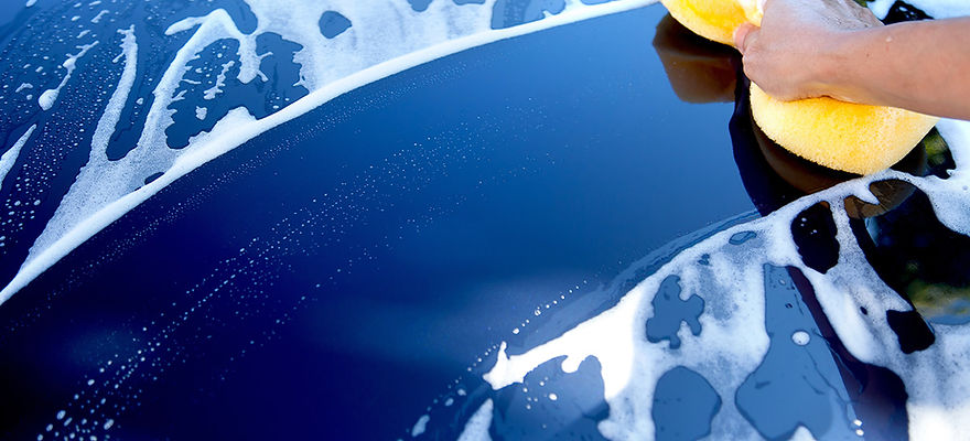 Blue car being washed