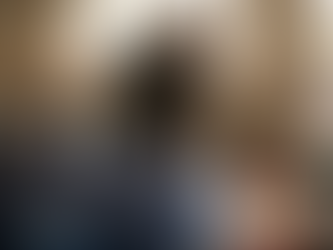 Detailer applying ceramic coating to car