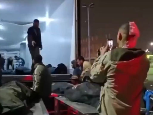 Refrigerated truck collecting the bodies of the victims for transfer