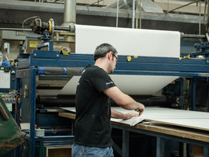 Cooper employee working on laminated wood components