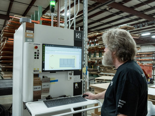 Cooper employee operating CNC