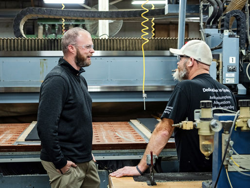 Cooper Enterprises team communicating on the production floor