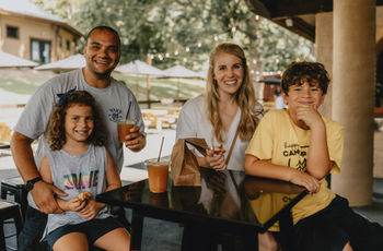 Happy family enjoys drinks and snacks at Jeter Mountain Farm