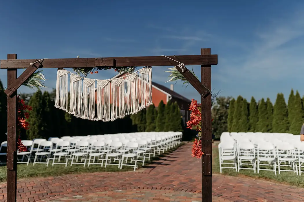 Wedding ceremony setup: chairs and arch at Union Manor