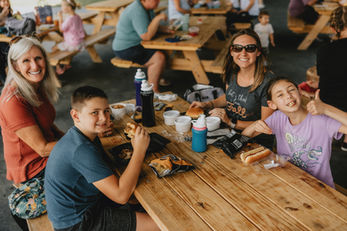Happy family enjoying lunch at Jeter Mountain Farm