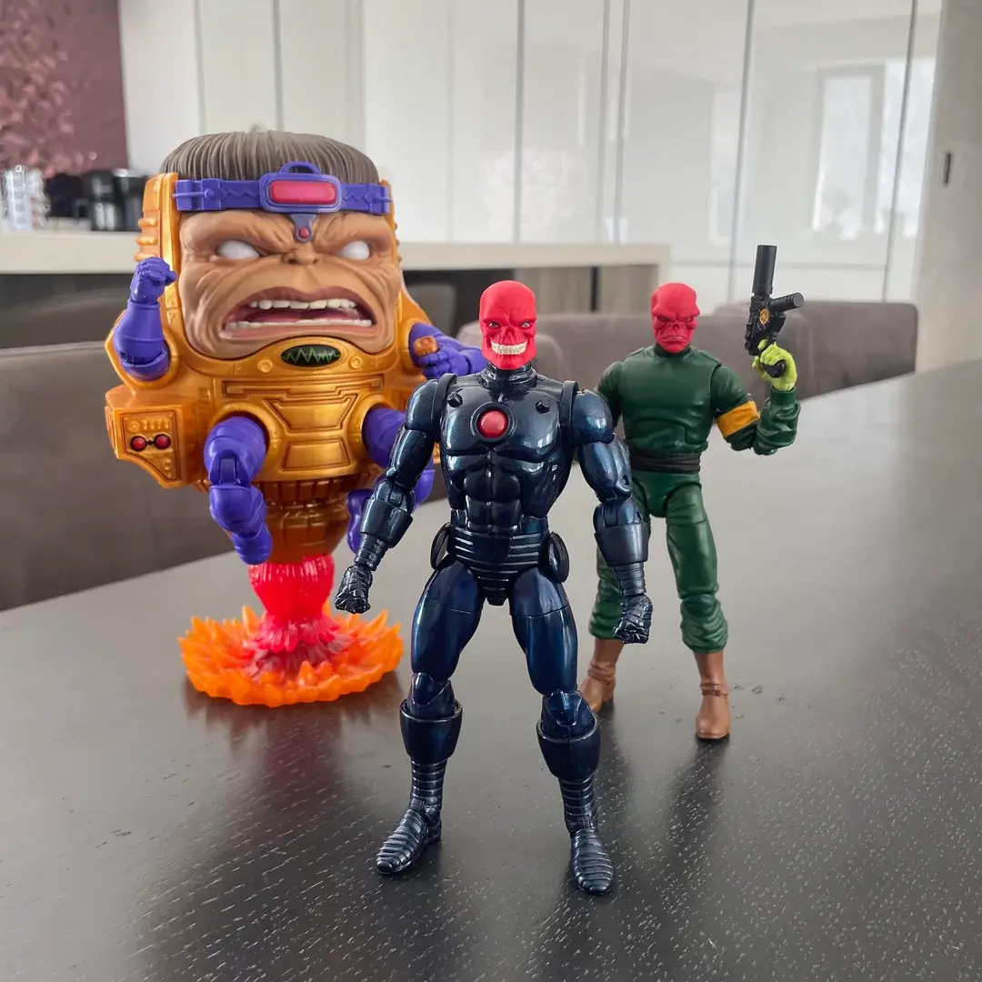 M.O.D.O.K. figure with two Red Skull action figures