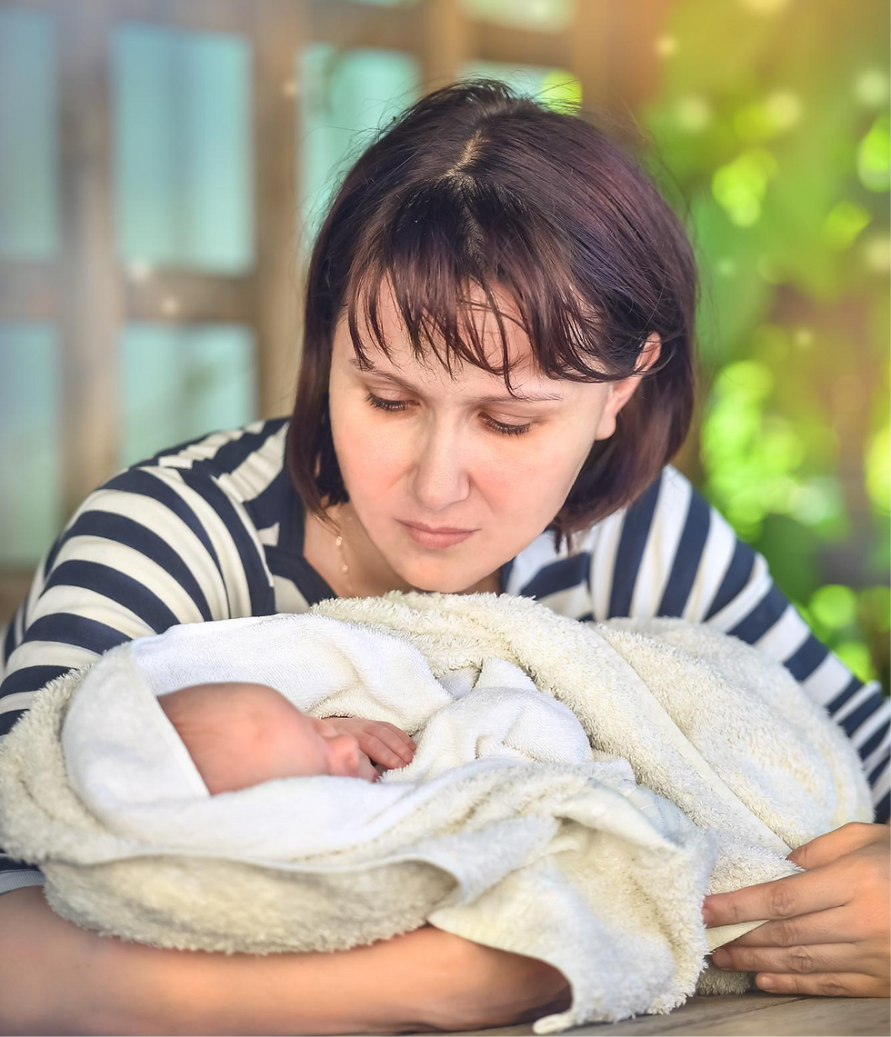 Mother lovingly cradles newborn baby