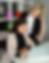 Two businesswomen collaborate on laptop