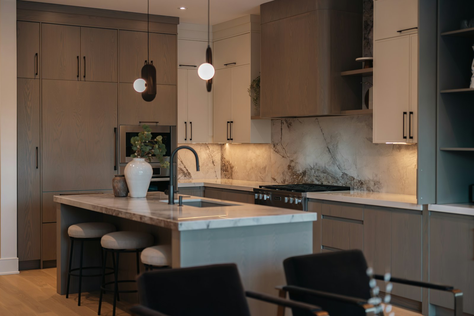 Modern kitchen with a marble backsplash and island