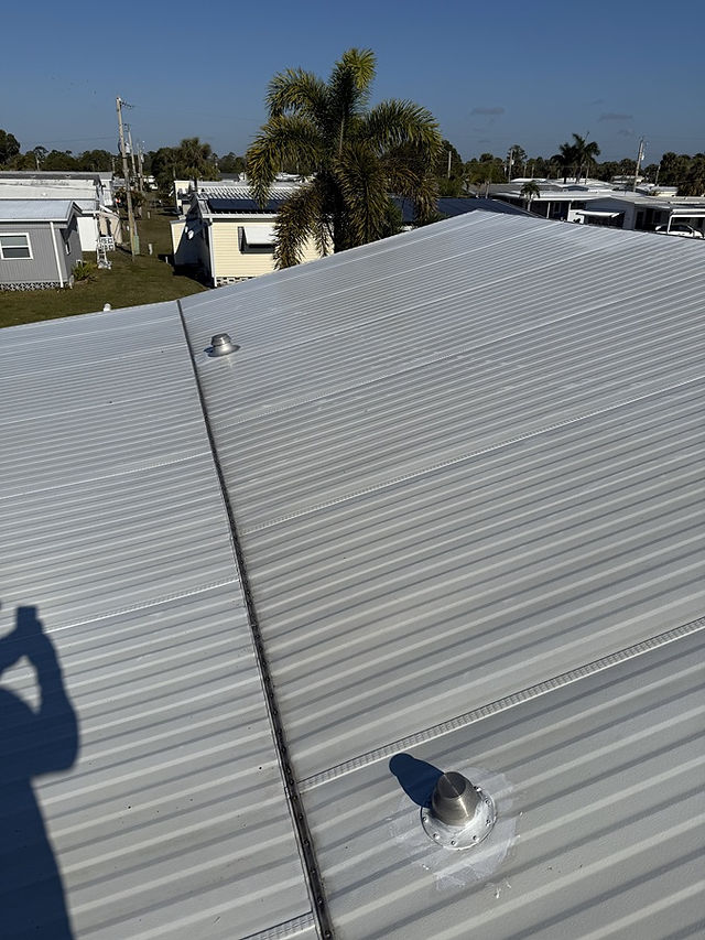 Metal roof in Cape Coral after professional soft wash cleaning, bright and spotless.