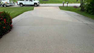 Results after professionally cleaned concrete driveway by AAA Pressure Washing in Cape Coral