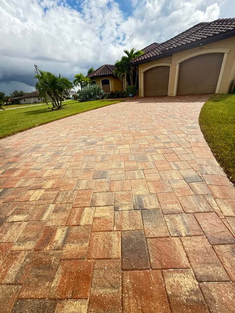 Completed paver sealing on a Cape Coral driveway showing enhanced color, restored surface, and long-lasting protection.