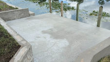Wide view of Cape Coral dock and seawall after professional pressure washing, looking bright, clean, and well-maintained.